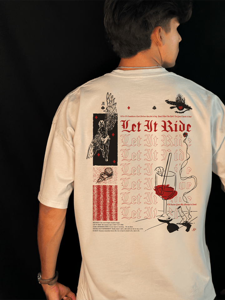 Back of the Let It Ride oversized tee in bone, worn, with red Let It Ride lettering, a winged Icarus, a burning eye and a small printed legend